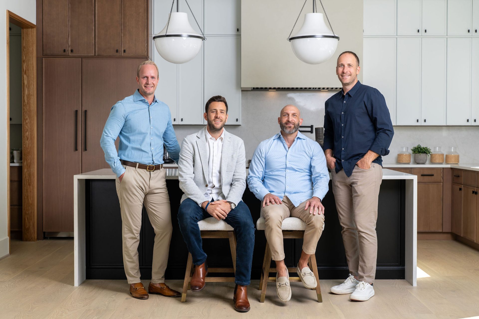 Owners of Design Pro Remodeling standing together, Northern Virginia home renovation and remodeling company